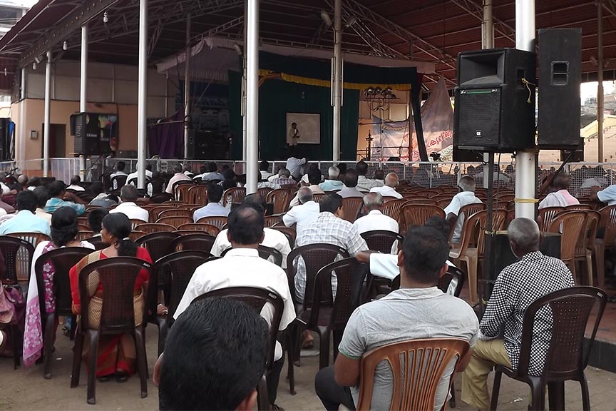 Pilgrims of the temple listening the talk